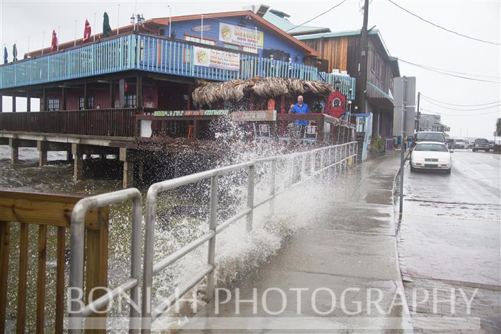 Black Dog Bar owner Jay Edge standing on his deck taunting Tropical Storm Andrea as she makes Landfall in Cedar Key Florida - Photo by Pat Bonish