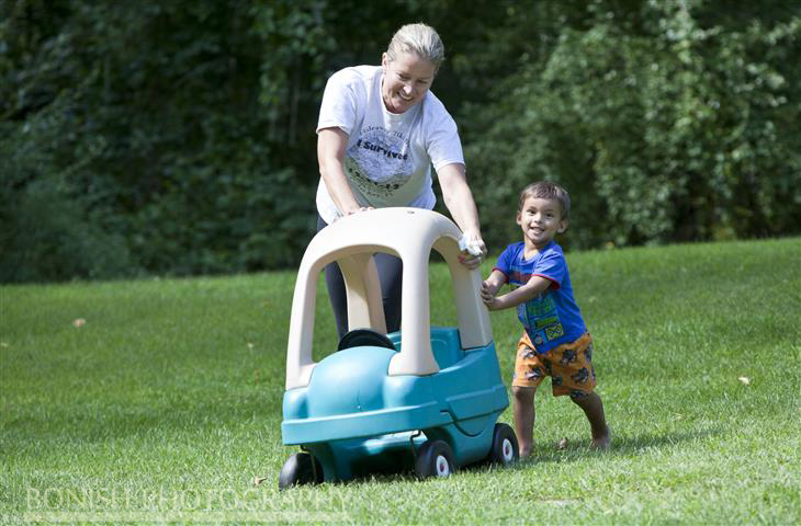 Oma & Jazper running in the Soft Grass - He enjoyed pushing this car as much as he enjoyed riding in it?
